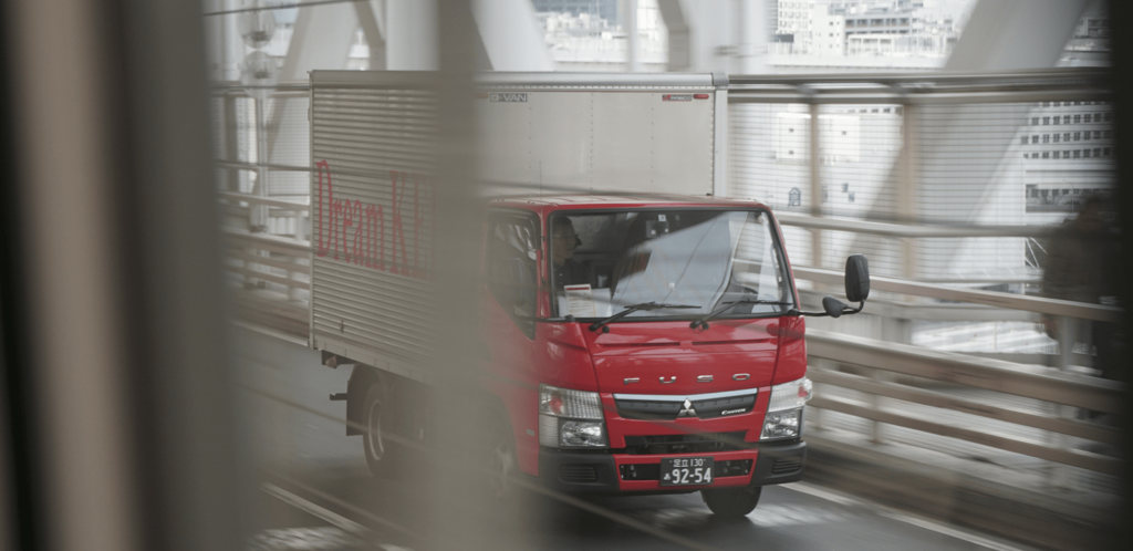 red semi truck on a bridge